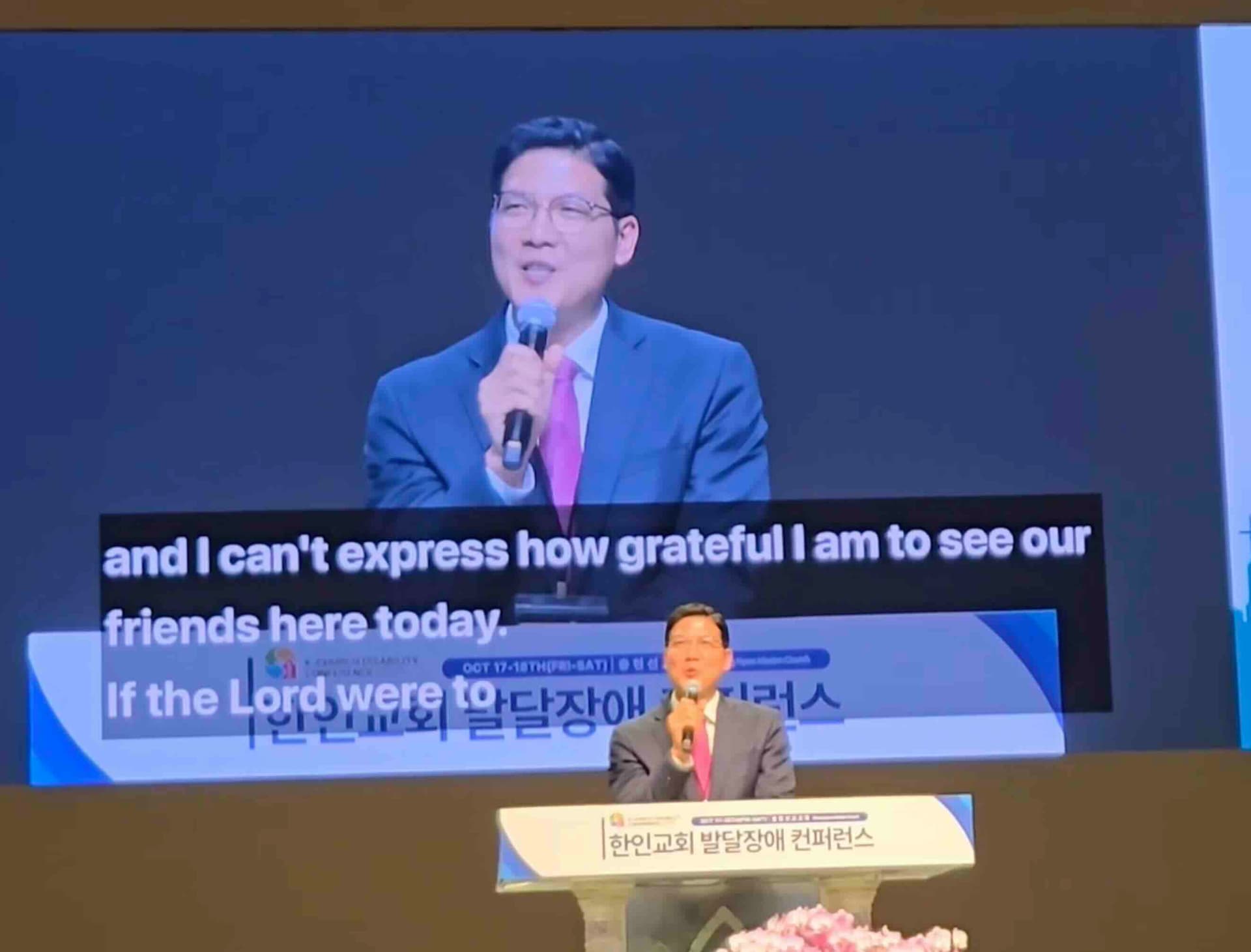 Live translation captions displayed on large screen during church service